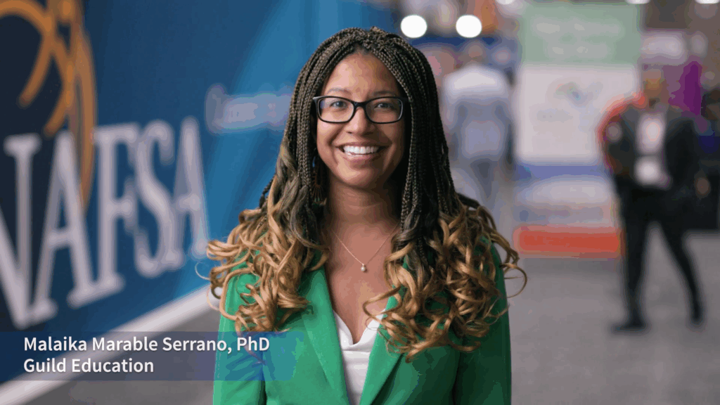 A Black professional woman in a bright green blazer from the international education community